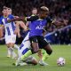 Ryan Sessegnon of Tottenham Hotspur runs with the ball from Solly March of Brighton.