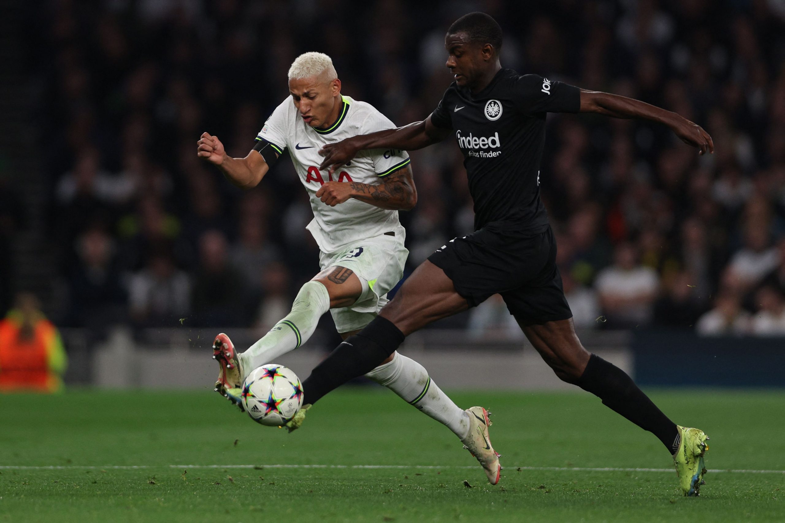 Tottenham Hotspur's Richarlison fights for the ball with Frankfurt's Evan N'Dicka.