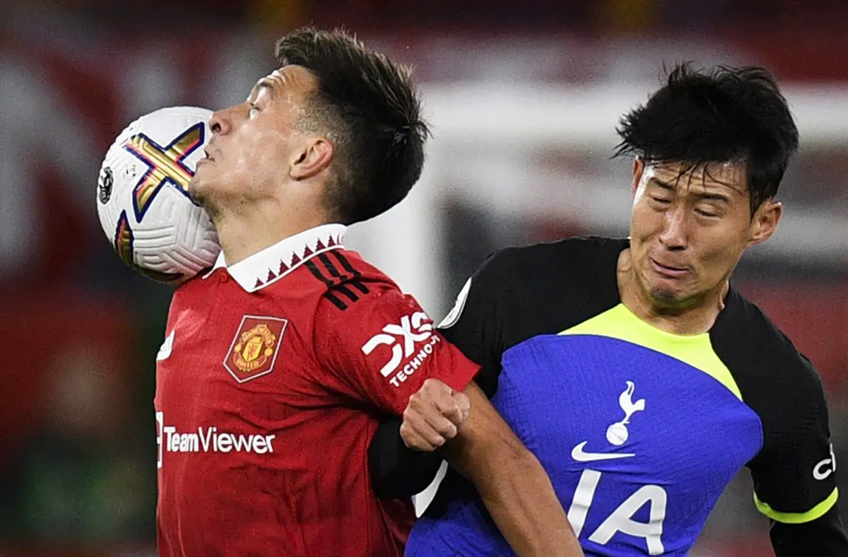Manchester United's Lisandro Martinez fights for the ball with Son Heung-min of Tottenham Hotspur. (Photo by OLI SCARFF/AFP via Getty Images)