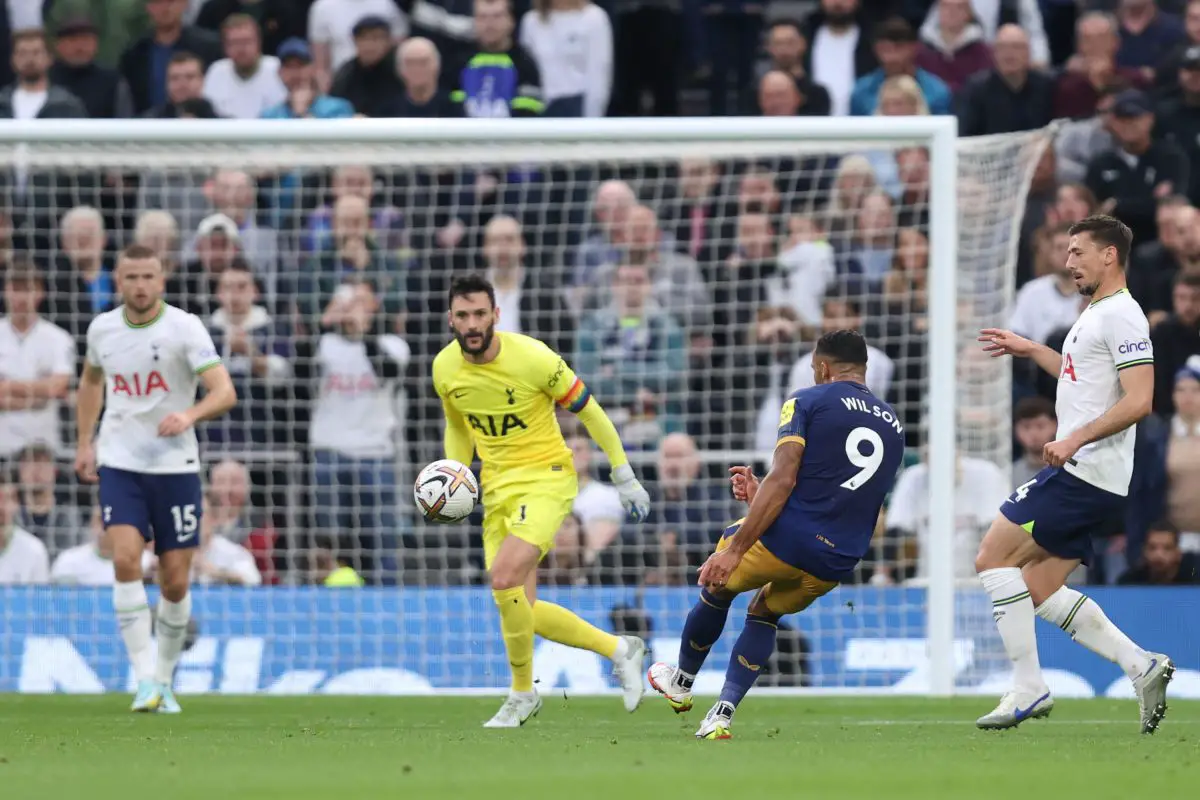 Callum Wilson of Newcastle United scores past Hugo Lloris as Tottenham's Eric Dier and Clement Lenglet watch on. 