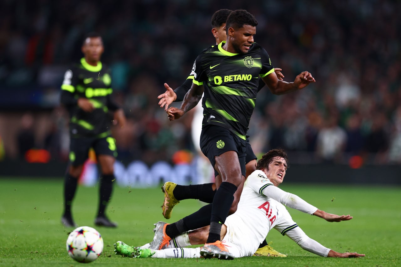 Bryan Gil of Tottenham Hotspur is tackled by Matheus Reis of Sporting CP during their UEFA Champions League match in October 2022.