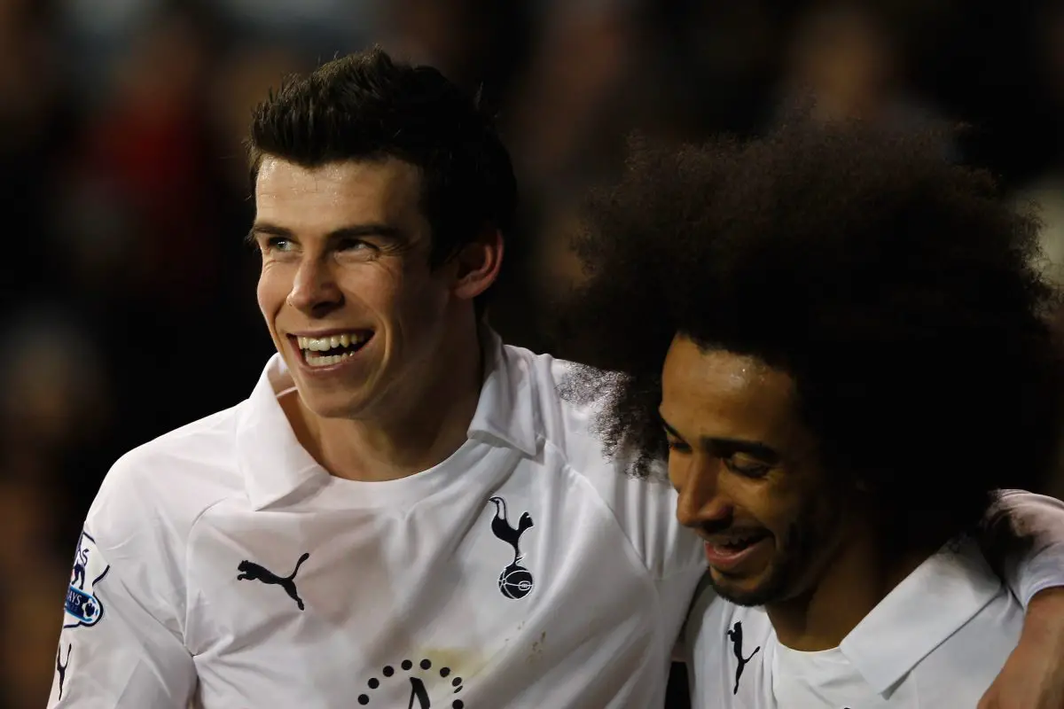  Gareth Bale of Spurs celebrates with teammate Benoit Assou-Ekotto after scoring against Wigan Athletic.