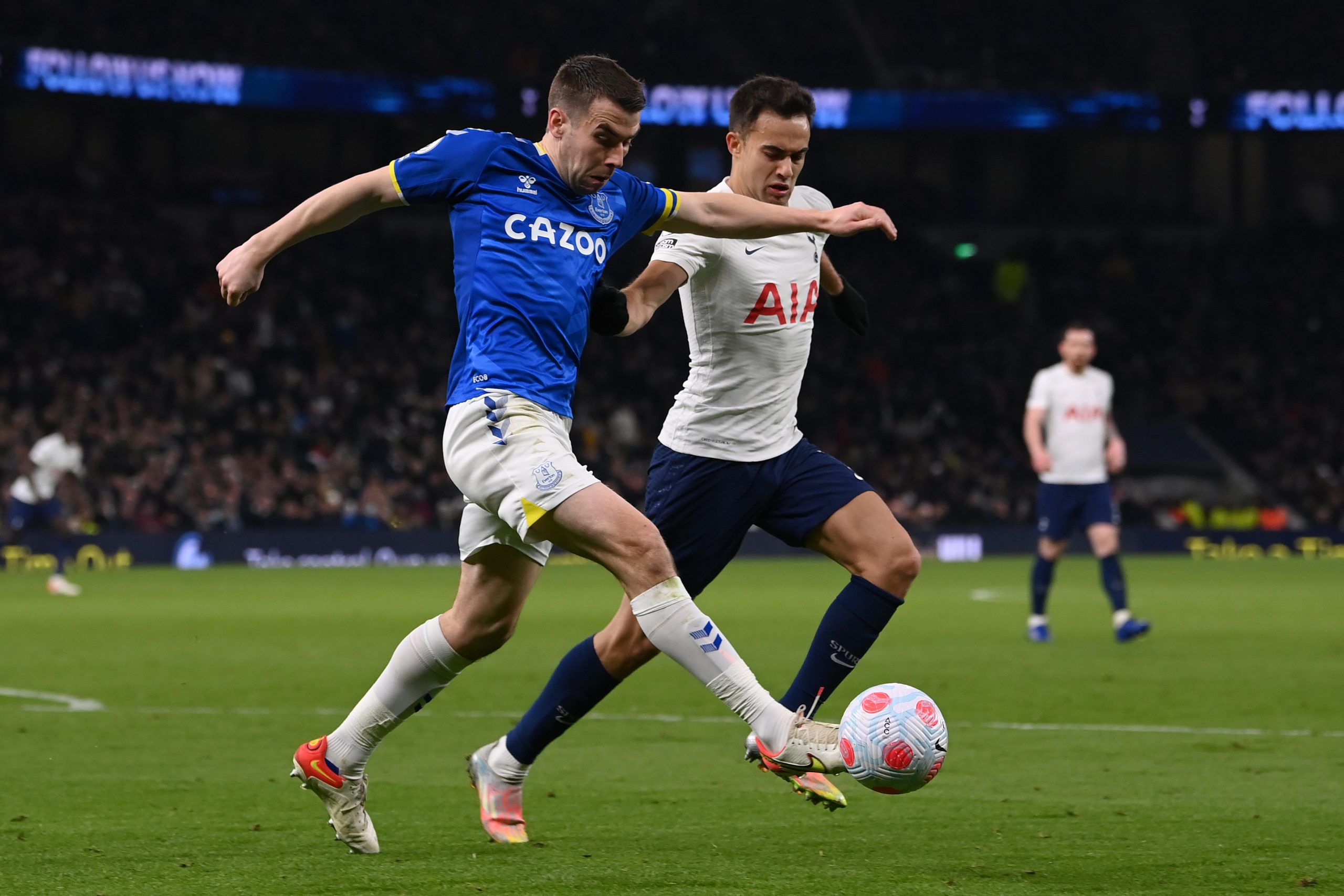Sergio Reguilon of Tottenham Hotspur challenges Seamus Coleman of Everton during a Premier League game in March 2022.