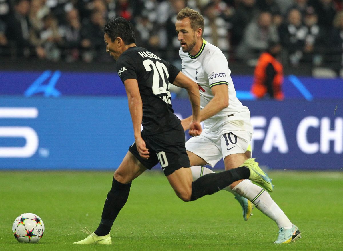Eintracht Frankfurt's Makoto Hasebe and Tottenham Hotspur's Harry Kane vie for the ball.
