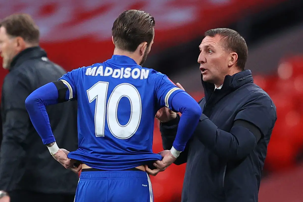 Brendan Rodgers speaks with Leicester City's James Maddison.