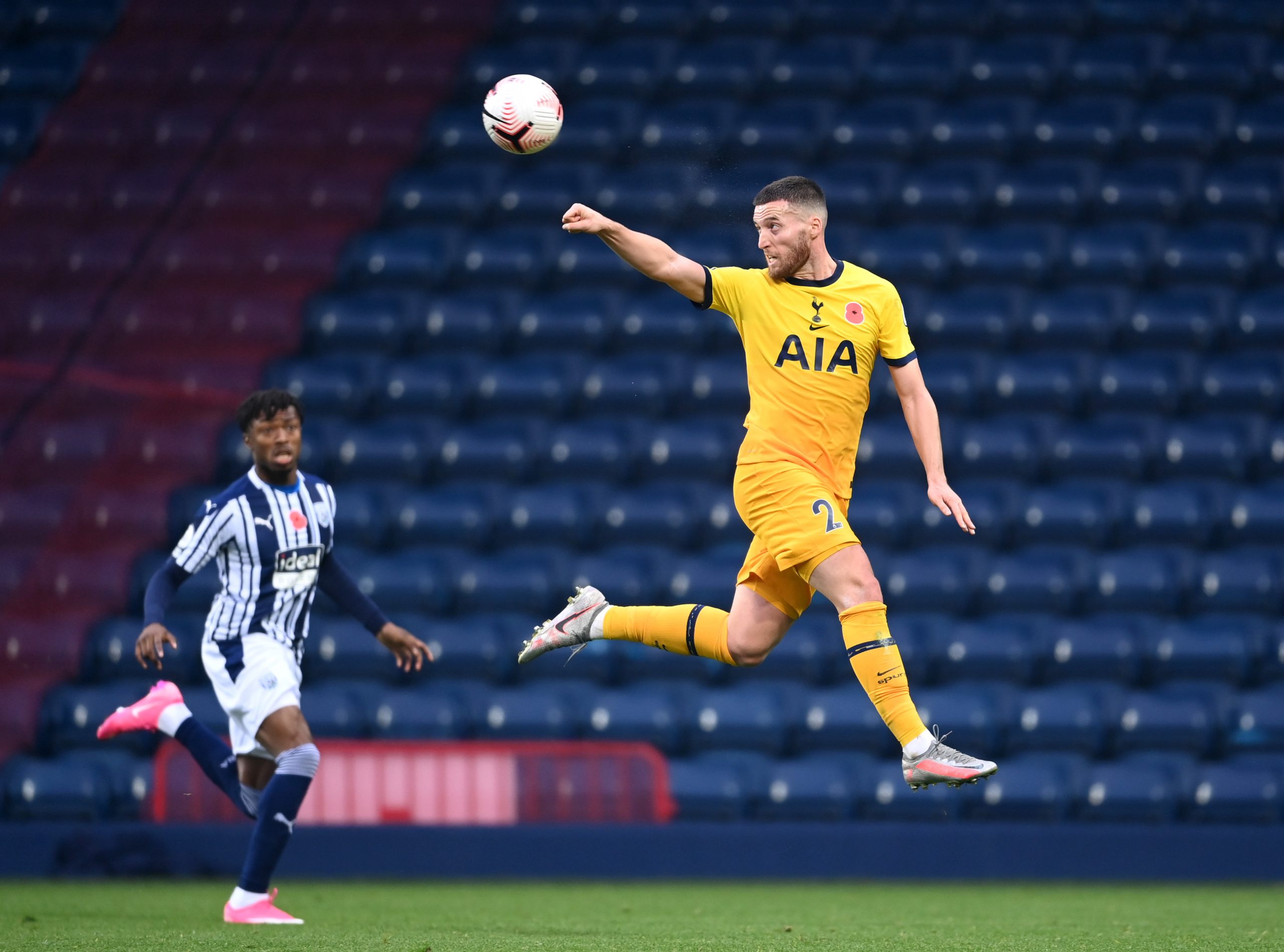 Matt Doherty of Tottenham Hotspur heads the ball during a game against West Bromwich Albion.