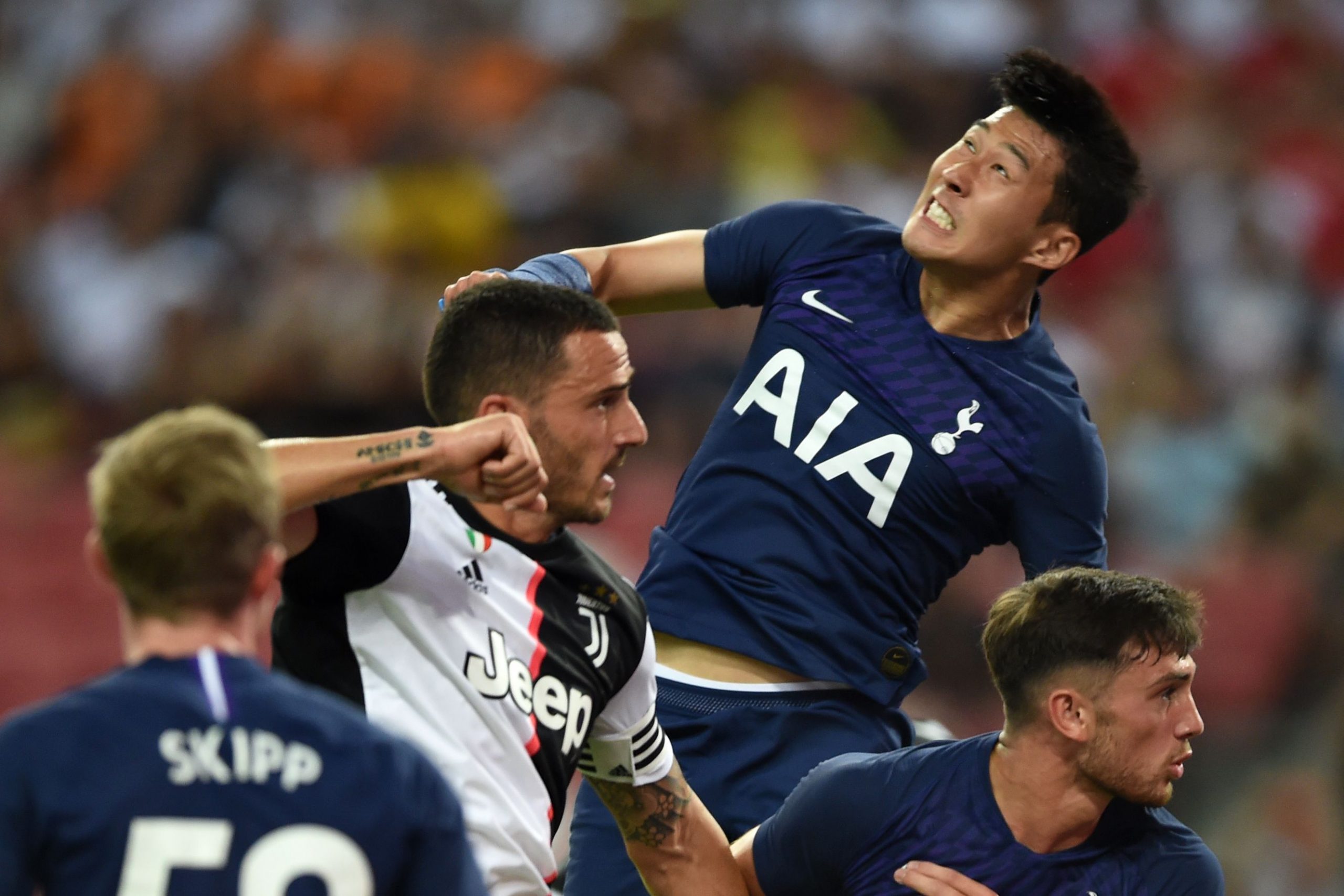 Juventus' Leonardo Bonucci contests for a header with Tottenham Hotspur's Son Heung-min during a friendly.