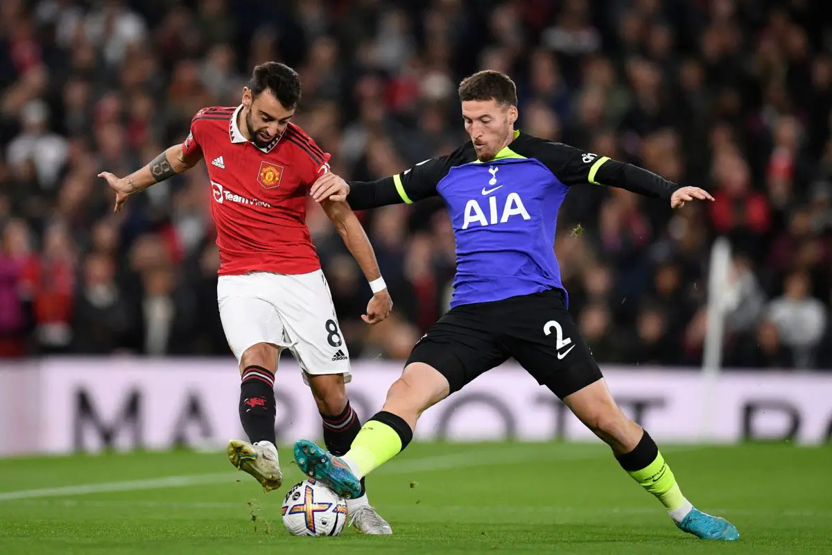 Manchester United's Bruno Fernandes jostles for possession with Tottenham Hotspur's Matt Doherty.