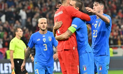 Gianluigi Donnarumma with Leonardo Bonucci and Alessandro Bastoni celebrate together for the Italy national team after a UEFA Nations League win against Hungary.