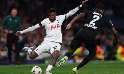Tottenham Hotspur's Emerson Royal fights for the ball with Frankfurt's Evan N'Dicka.