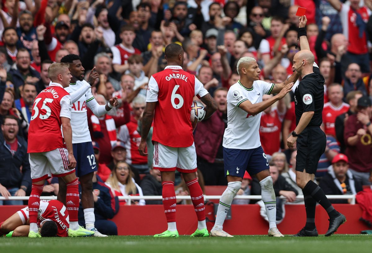 Referee Anthony Taylor sends off Tottenham Hotspur's Emerson Royal after a foul on Arsenal's Gabriel Martinelli.