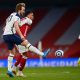Harry Kane of Tottenham Hotspur battles for possession with Gabriel Magalhaes of Arsenal.