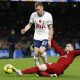 Tottenham Hotspur's Dejan Kulusevski is challenged by Andy Robertson of Liverpool