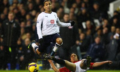Aaron Lennon of Tottenham Hotspur is challenged by Rafael Da Silva of Manchester United. (Photo by Mike Hewitt/Getty Images)