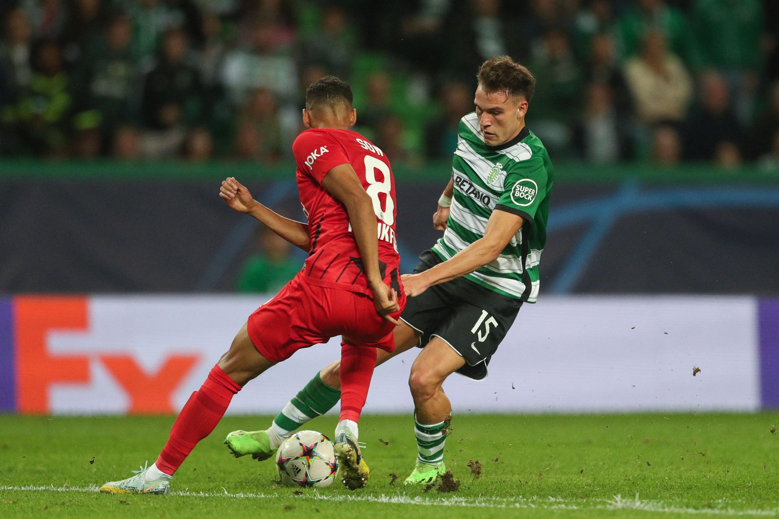 Frankfurt's Djibril Sow fights for the ball with Sporting Lisbon's Manuel Ugarte.