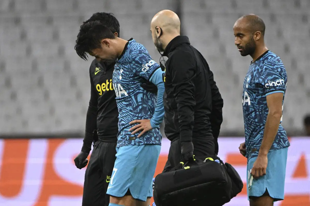 Tottenham Hotspur's Son Heung-min walks off the pitch against Marseille as Lucas Moura watches on. (Photo by CHRISTOPHE SIMON/AFP via Getty Images)