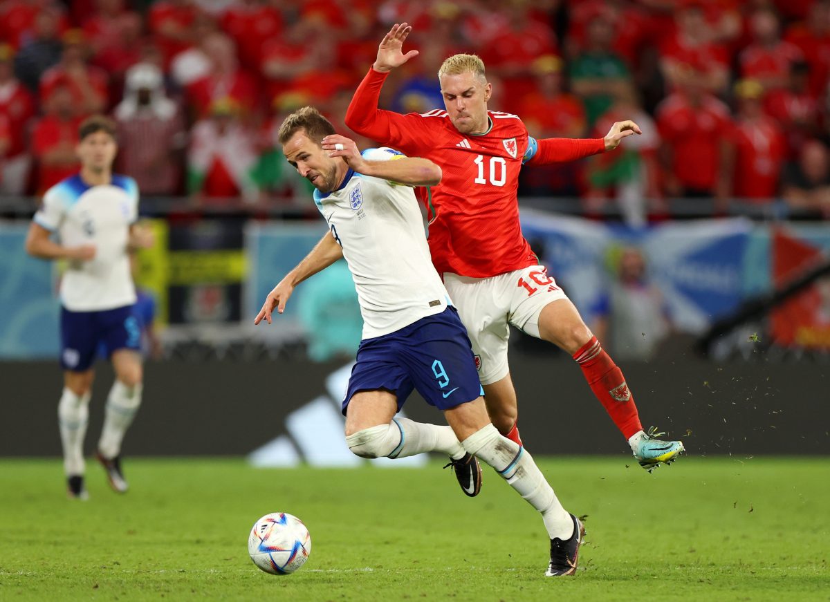 Harry Kane of England and Tottenham Hotspur controls the ball under pressure of Aaron Ramsey of Wales. (Photo by Francois Nel/Getty Images)
