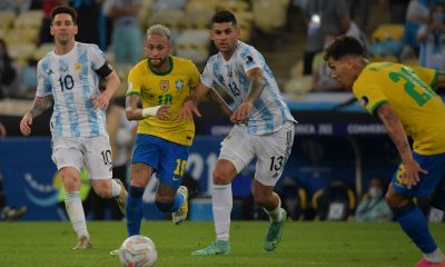 Cristian Romero vie for the ball as Lionel Messi and Roberto Firmino look on during the 2021 Copa America final.
