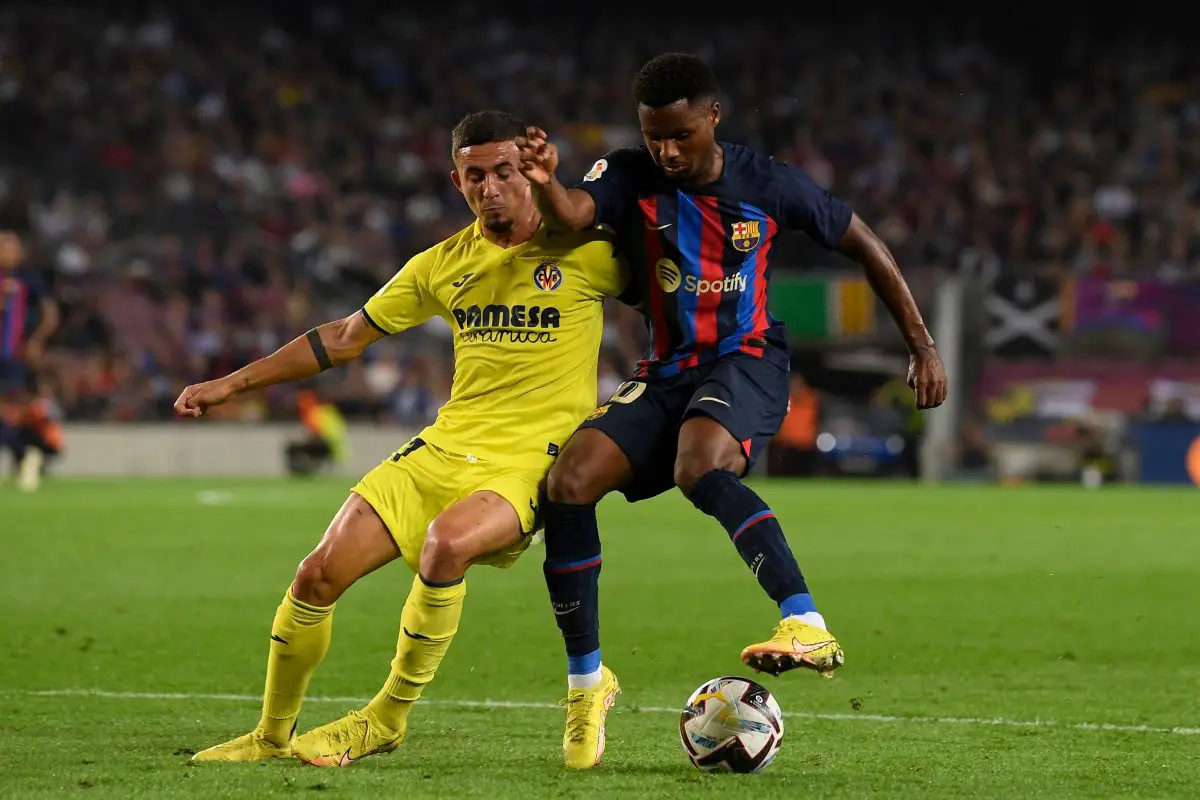 Villarreal's Yeremi Pino and Barcelona's Ansu Fati vie for possession. (Photo by JOSEP LAGO/AFP via Getty Images)