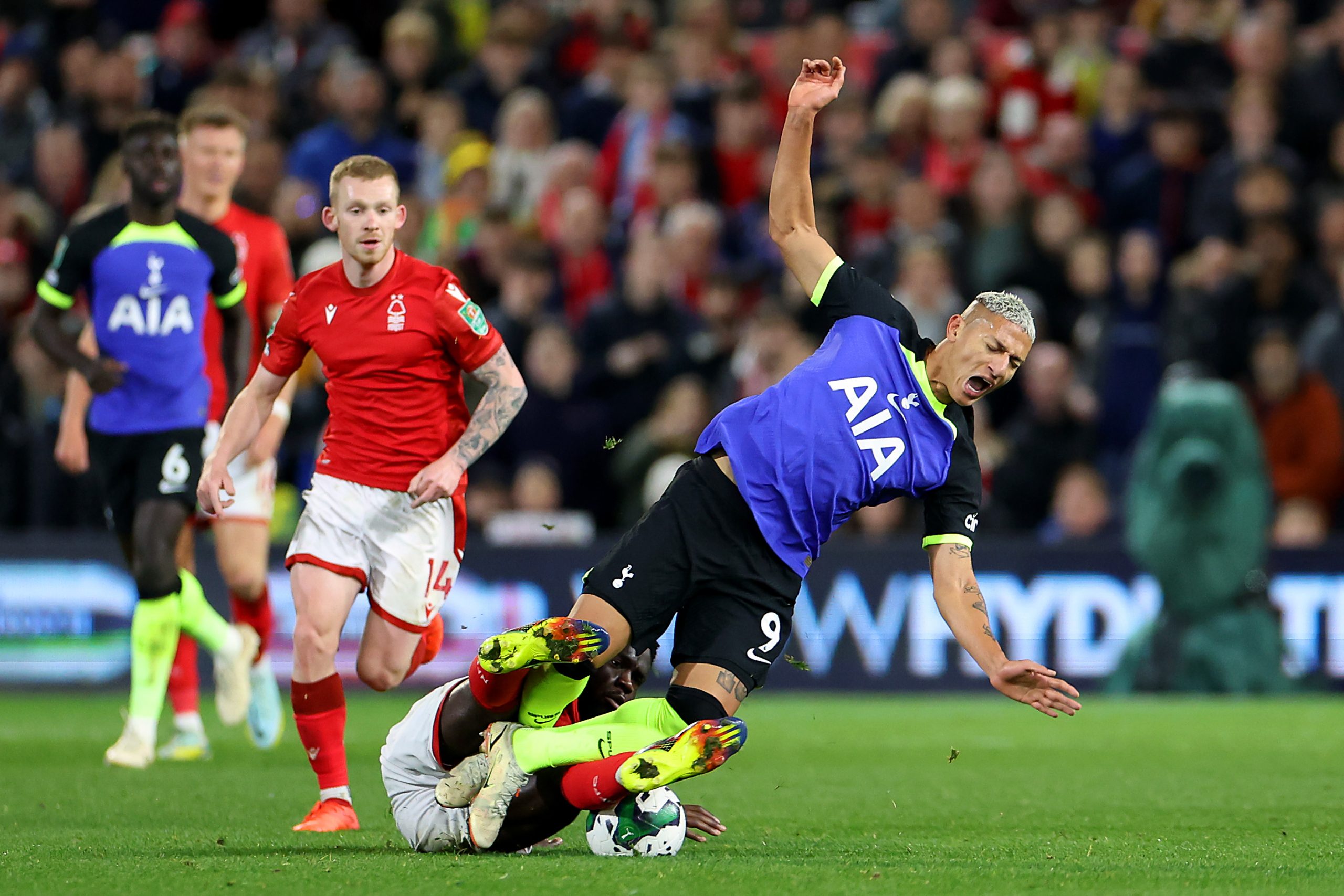 NOTTINGHAM, ENGLAND - NOVEMBER 09: Richarlison of Tottenham Hotspur is tackled by Orel Mangala of Nottingham Forest during the Carabao Cup Third Round match between Nottingham Forest and Tottenham Hotspur at City Ground on November 09, 2022 in Nottingham, England. (Photo by Catherine Ivill/Getty Images )