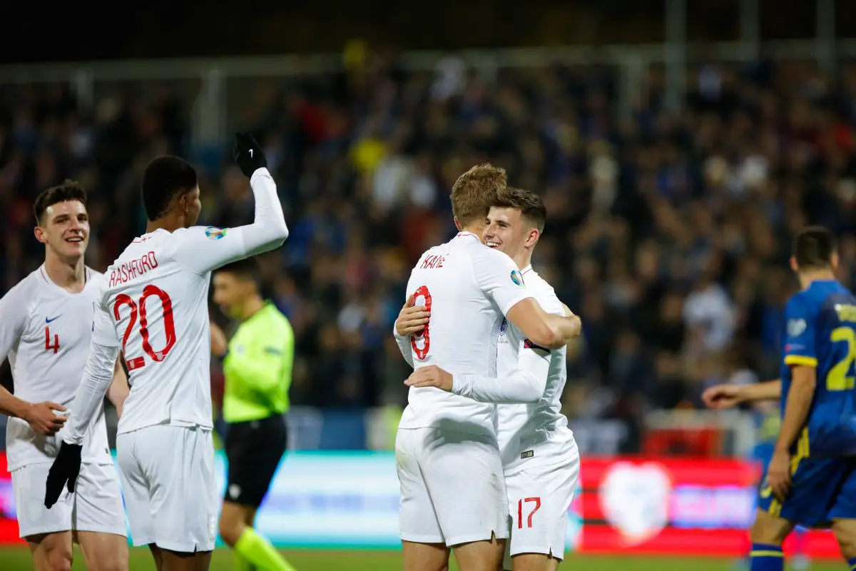 Harry Kane celebrates with Mason Mount of England. (Photo by ARMEND NIMANI/AFP via Getty Images)