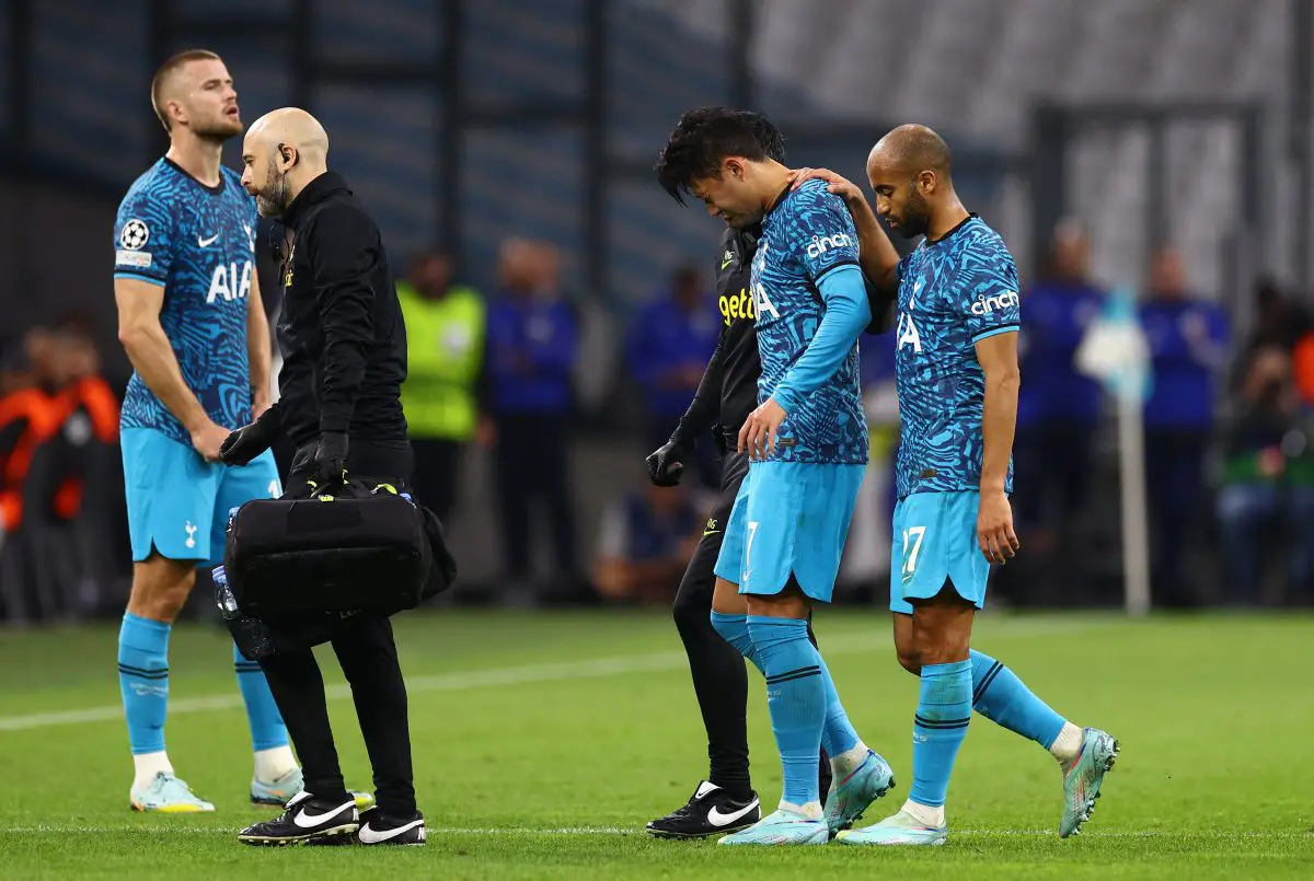 Son Heung-min helped off the pitch by Tottenham Hotspur's medical staff after a possible concussion against Marseille. 