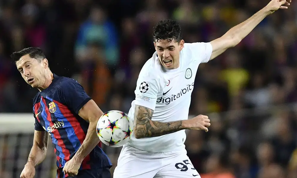 Barcelona's Robert Lewandowski vies with Inter Milan's Alessandro Bastoni. (Photo by PAU BARRENA/AFP via Getty Images)