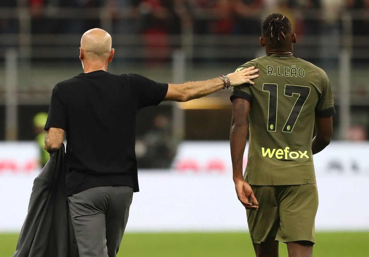 AC Milan coach Stefano Pioli embraces Rafael Leao. (Photo by Marco Luzzani/Getty Images)