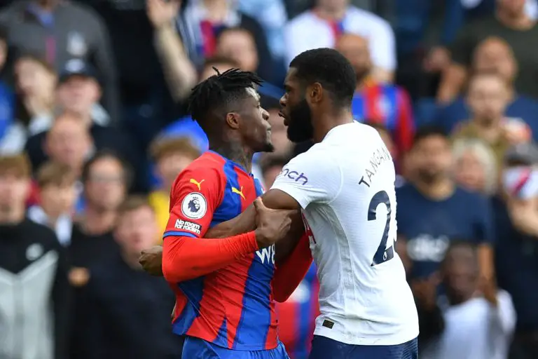 Crystal Palace's Wilfried Zaha and Tottenham Hotspur's Japhet Tanganga engage in a confrontation.
