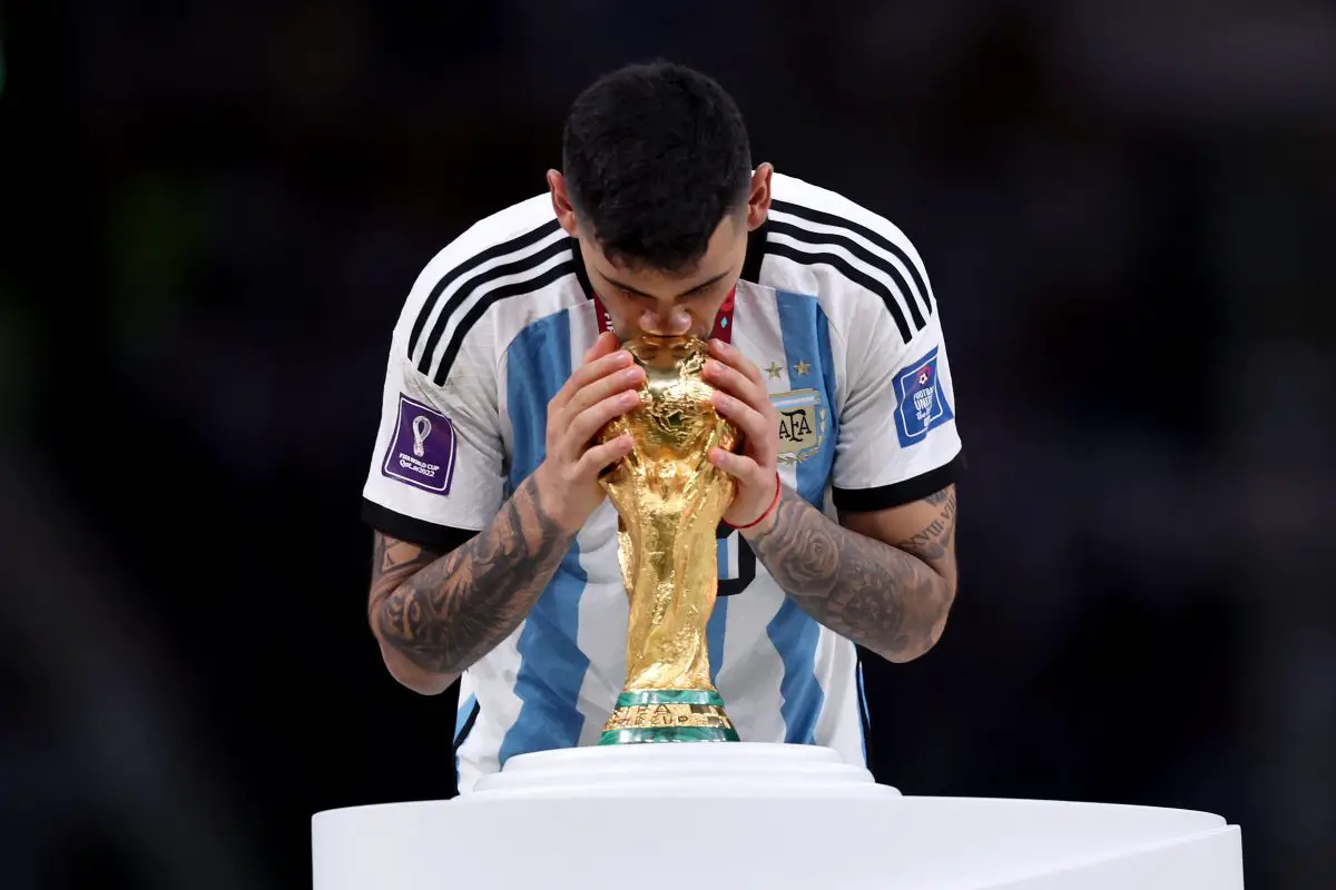 Cristian Romero of Argentina kisses the FIFA World Cup winning trophy during the award ceremony following the FIFA World Cup Qatar 2022 Final match between Argentina and France at Lusail Stadium on December 18, 2022 in Lusail City, Qatar. (Photo by Clive Brunskill/Getty Images)