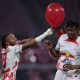 Leipzig's French midfielder Christopher Nkunku (L) and Leipzig's French defender Mohamed Simakan celebrate after winning the German first division Bundesliga football match between RB Leipzig and SC Freiburg in Leizpig, eastern Germany, on November 9, 2022. - DFL REGULATIONS PROHIBIT ANY USE OF PHOTOGRAPHS AS IMAGE SEQUENCES AND/OR QUASI-VIDEO (Photo by Ronny HARTMANN / AFP) / DFL REGULATIONS PROHIBIT ANY USE OF PHOTOGRAPHS AS IMAGE SEQUENCES AND/OR QUASI-VIDEO (Photo by RONNY HARTMANN/AFP via Getty Images)