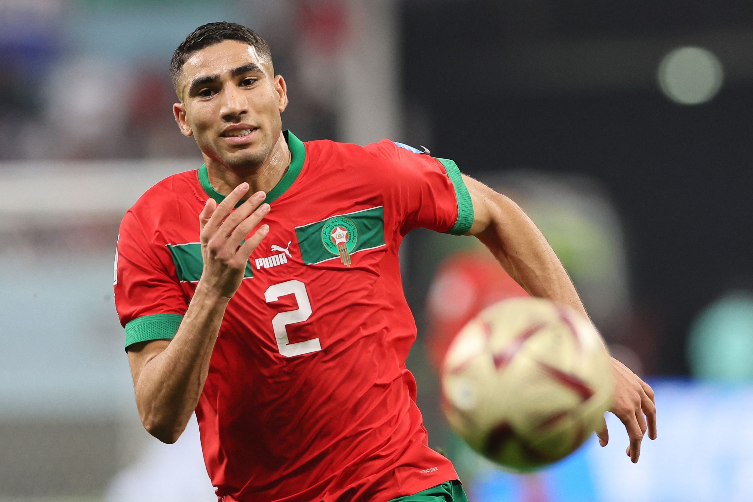Morocco's defender #02 Achraf Hakimi runs for the ball during the Qatar 2022 World Cup third place play-off football match between Croatia and Morocco at Khalifa International Stadium in Doha on December 17, 2022. (Photo by KARIM JAAFAR / AFP) (Photo by KARIM JAAFAR/AFP via Getty Images)
