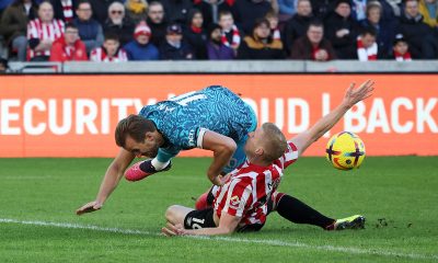 Harry Kane of Tottenham Hotspur is tackled by Ben Mee of Brentford inside the penalty area during the Premier League match between Brentford FC and Tottenham Hotspur at Brentford Community Stadium on December 26, 2022 in Brentford, England. (Photo by Eddie Keogh/Getty Images)