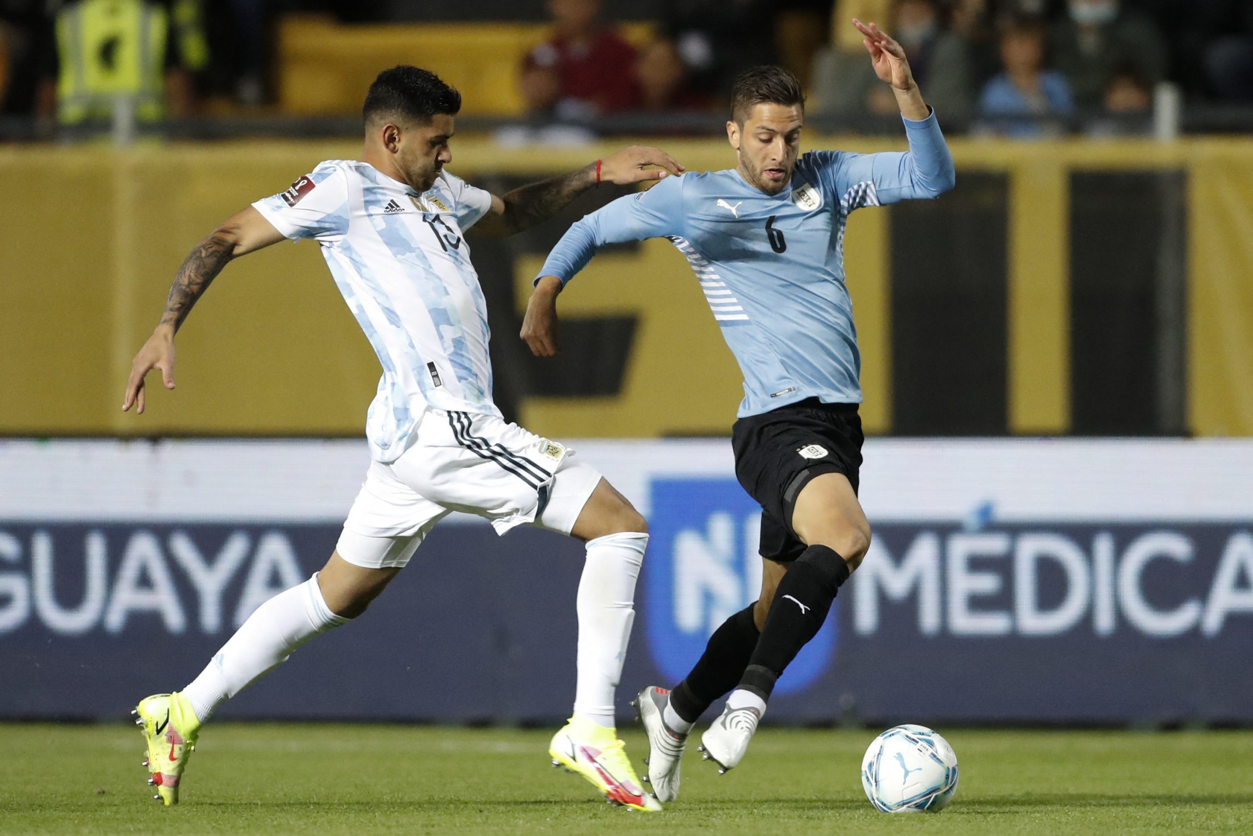 Argentina's Cristian Romero (L) and Uruguay's Rodrigo Bentancur vie for the ball during their South American qualification football match for the FIFA World Cup Qatar 2022 at the Campeon del Siglo stadium in Montevideo on November 12, 2021. (Photo by Matilde Campodonico / POOL / AFP) (Photo by MATILDE CAMPODONICO/POOL/AFP via Getty Images)