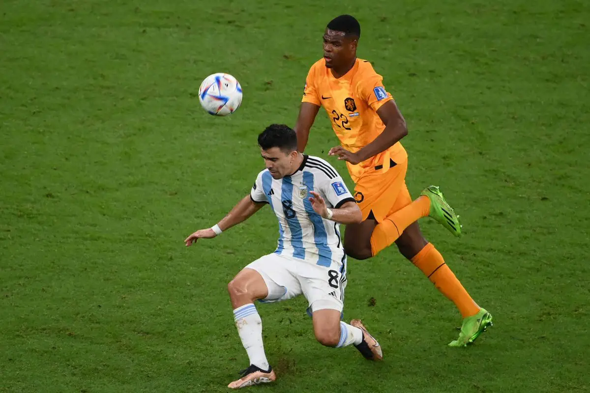 Marcos Acuna of Argentina in action against the Netherlands' Denzel Dumfries. (Photo by FRANCK FIFE/AFP via Getty Images)