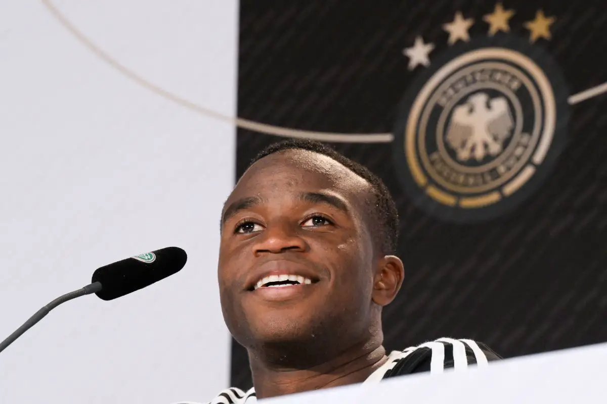 Germany's forward Youssoufa Moukoko smiles during a press conference. 