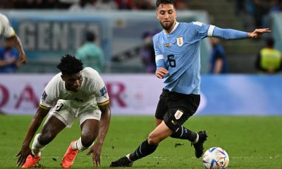 Ghana's midfielder #20 Mohammed Kudus vies with Uruguay's midfielder #06 Rodrigo Bentancur during the Qatar 2022 World Cup Group H football match between Ghana and Uruguay at the Al-Janoub Stadium in Al-Wakrah, south of Doha on December 2, 2022. (Photo by Pablo PORCIUNCULA / AFP) (Photo by PABLO PORCIUNCULA/AFP via Getty Images)