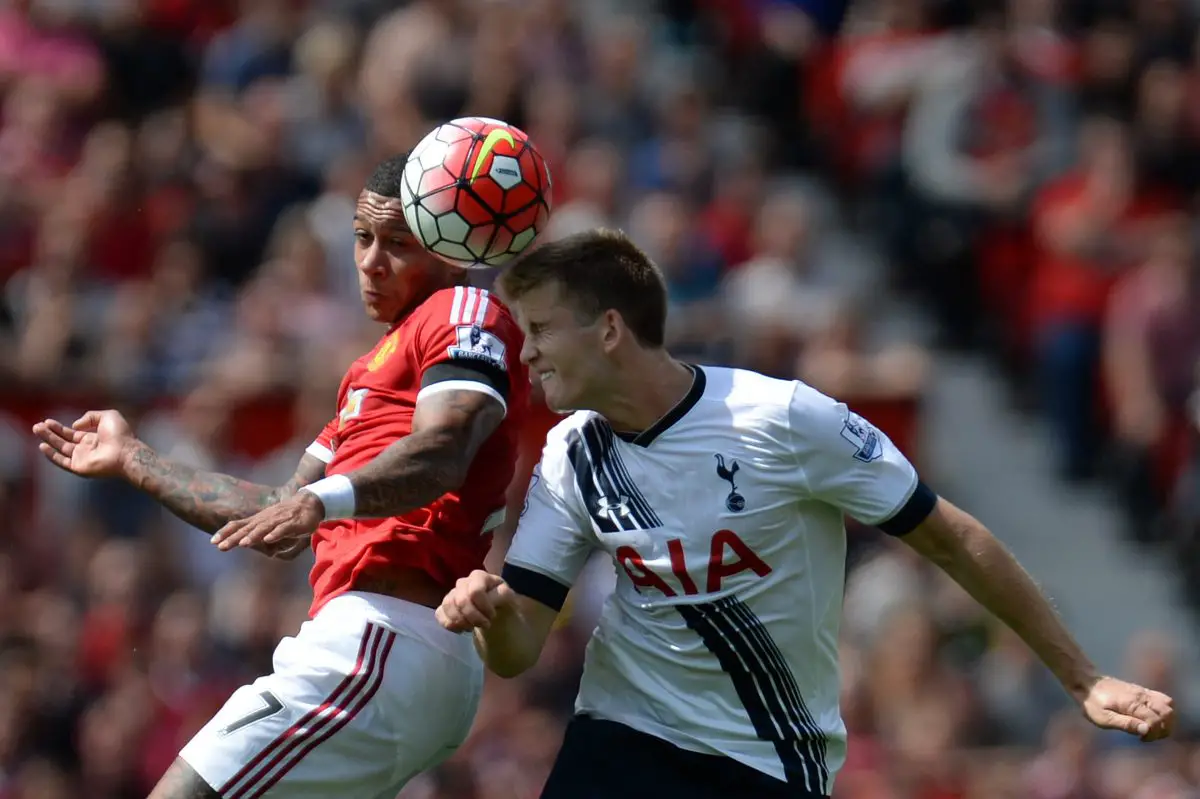 Manchester United's Memphis Depay and Tottenham Hotspur's Eric Dier in action. 