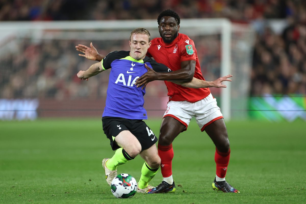 Oliver Skipp of Tottenham Hotspur holds off Orel Mangala of Nottingham Forest during a Carabao Cup game.
