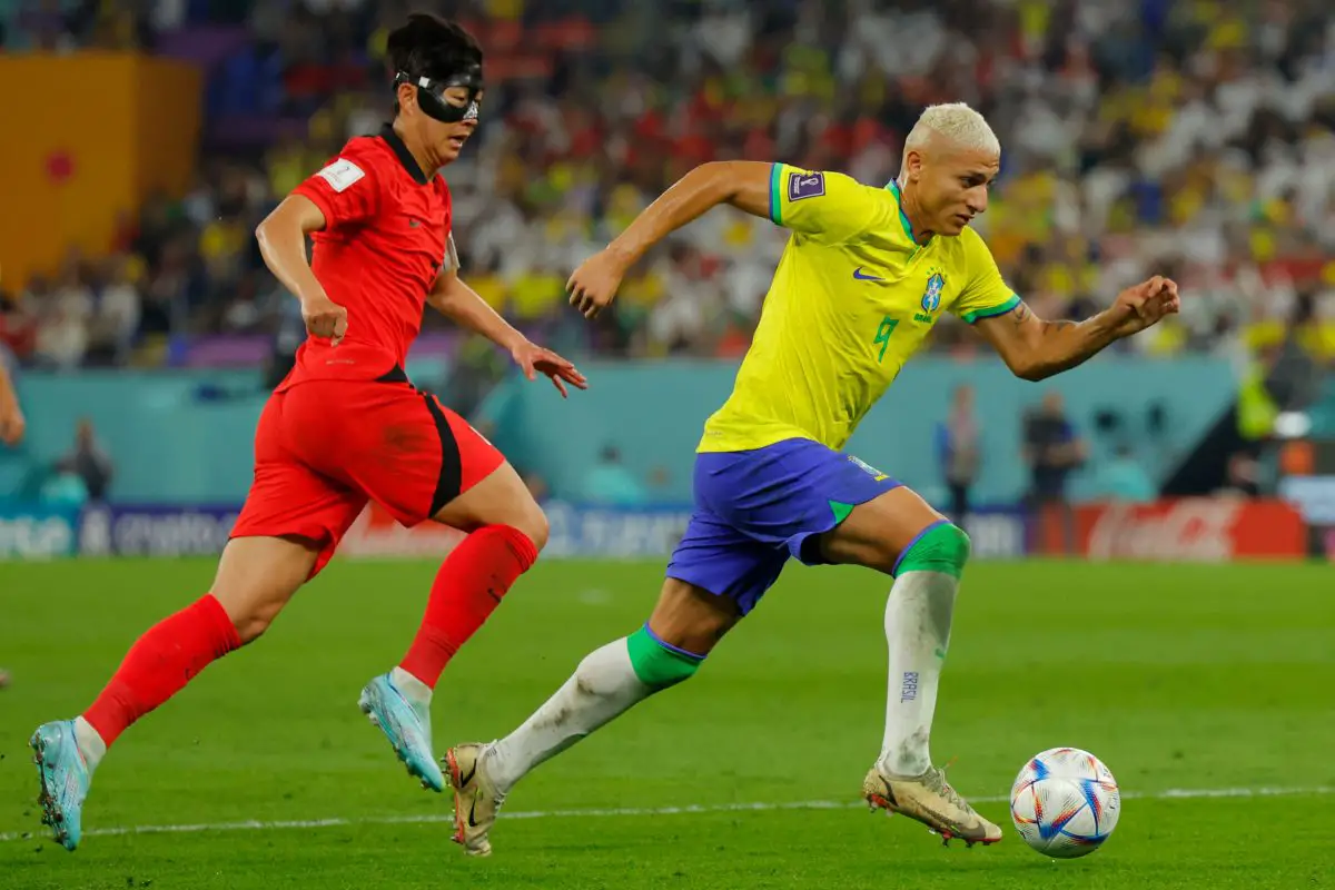 Brazil's forward Richarlison (R) and South Korea's Son Heung-min fight for the ball. (Photo by ODD ANDERSEN/AFP via Getty Images)