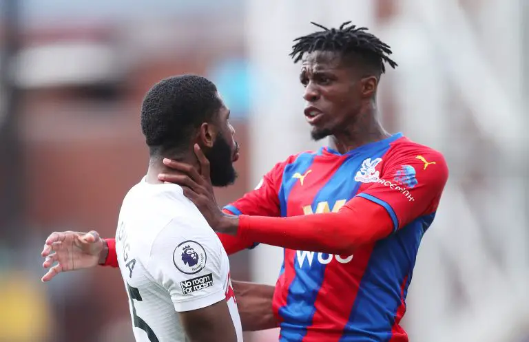 Wilfried Zaha of Crystal Palace clashes with Japhet Tanganga of Tottenham Hotspur during the Premier League match between Crystal Palace and Tottenham Hotspur at Selhurst Park on September 11, 2021 in London, England. (Photo by Alex Morton/Getty Images)