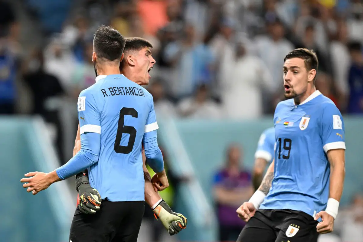 Uruguay's Sergio Rochet reacts towards Rodrigo Bentancur. (Photo by ALFREDO ESTRELLA/AFP via Getty Images)