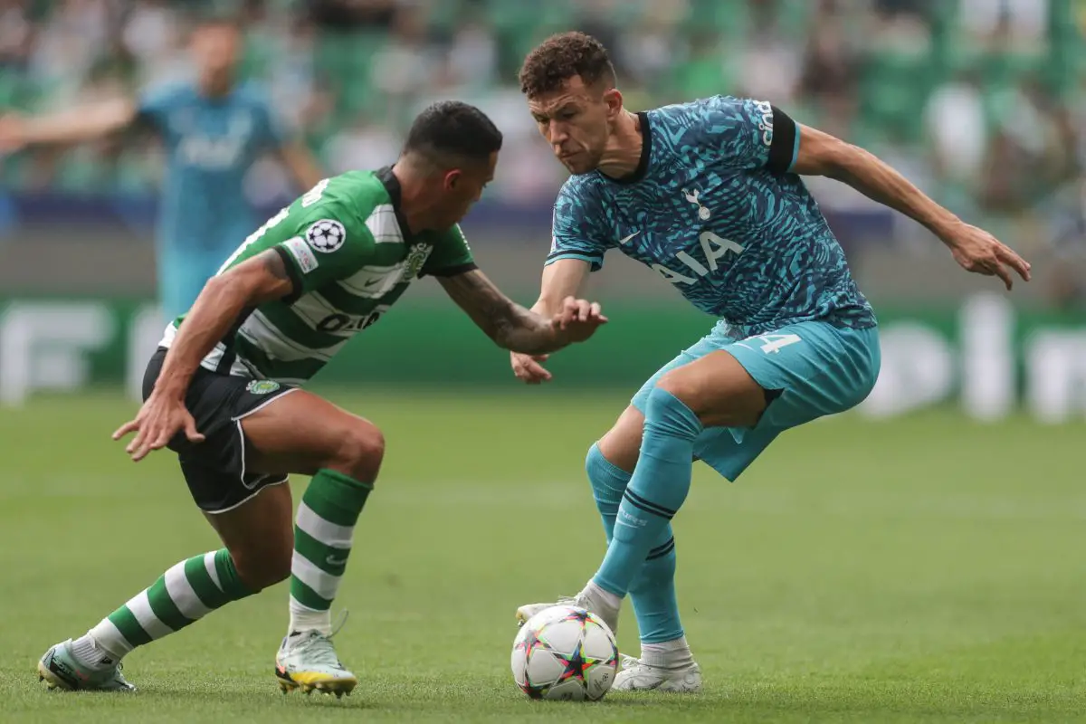 Sporting Lisbon's Pedro Porro fights for the ball with Tottenham Hotspur's Ivan Perisic. (Photo by CARLOS COSTA/AFP via Getty Images)