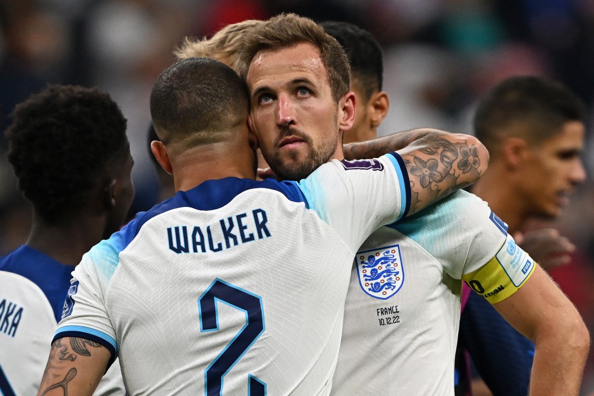 England's defender #02 Kyle Walker and England's forward #09 Harry Kane react at the end of the Qatar 2022 World Cup quarter-final football match between England and France at the Al-Bayt Stadium in Al Khor, north of Doha, on December 10, 2022. (Photo by Paul ELLIS / AFP) (Photo by PAUL ELLIS/AFP via Getty Images)