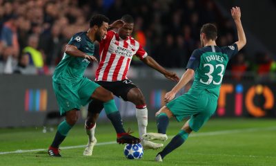 Mousa Dembele and Ben Davies of Tottenham Hotspur challenge Denzel Dumfries of PSV Eindhoven. (Photo by Catherine Ivill/Getty Images)