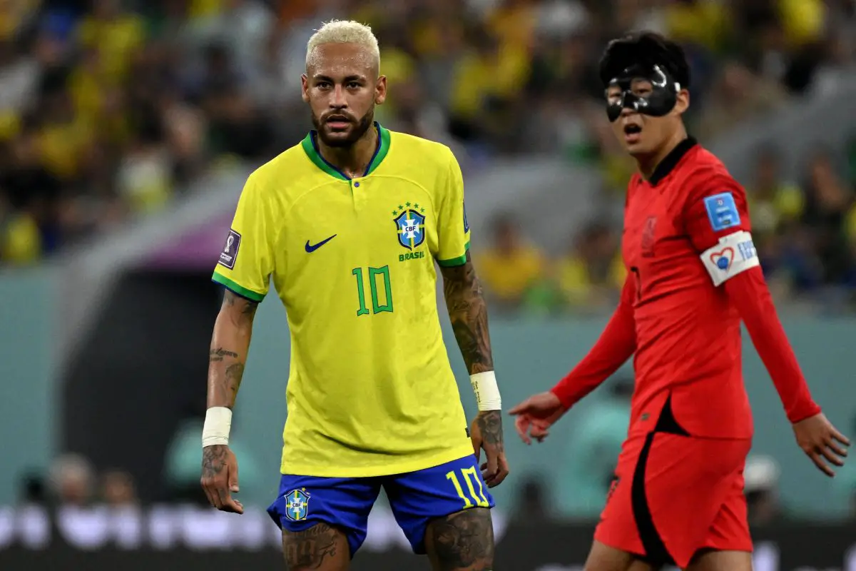Brazil's Neymar Jr. with Son Heung-min of Tottenham Hotspur and South Korea at the 2022 FIFA World Cup in Qatar. (Photo by PABLO PORCIUNCULA/AFP via Getty Images)