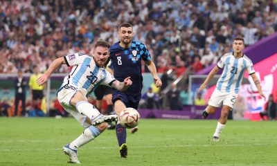 LUSAIL CITY, QATAR - DECEMBER 13: Alexis Mac Allister of Argentina shoots the ball against Mateo Kovacic of Croatia during the FIFA World Cup Qatar 2022 semi final match between Argentina and Croatia at Lusail Stadium on December 13, 2022 in Lusail City, Qatar. (Photo by Lars Baron/Getty Images)