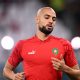 Morocco's midfielder Sofyan Amrabat warms up before the Qatar 2022 World Cup round of 16 football match between Morocco and Spain at the Education City Stadium in Al-Rayyan, west of Doha on December 6, 2022