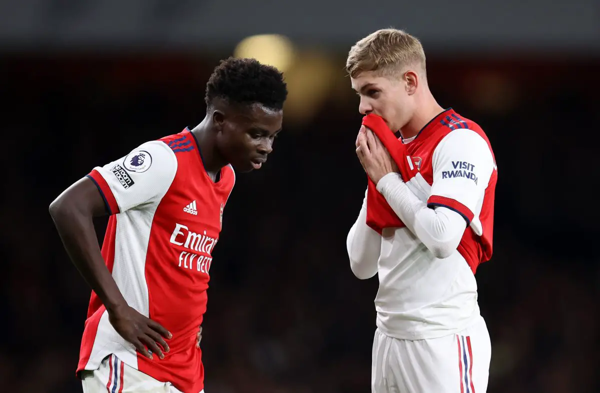 Bukayo Saka talks to teammate Emile Smith Rowe of Arsenal.