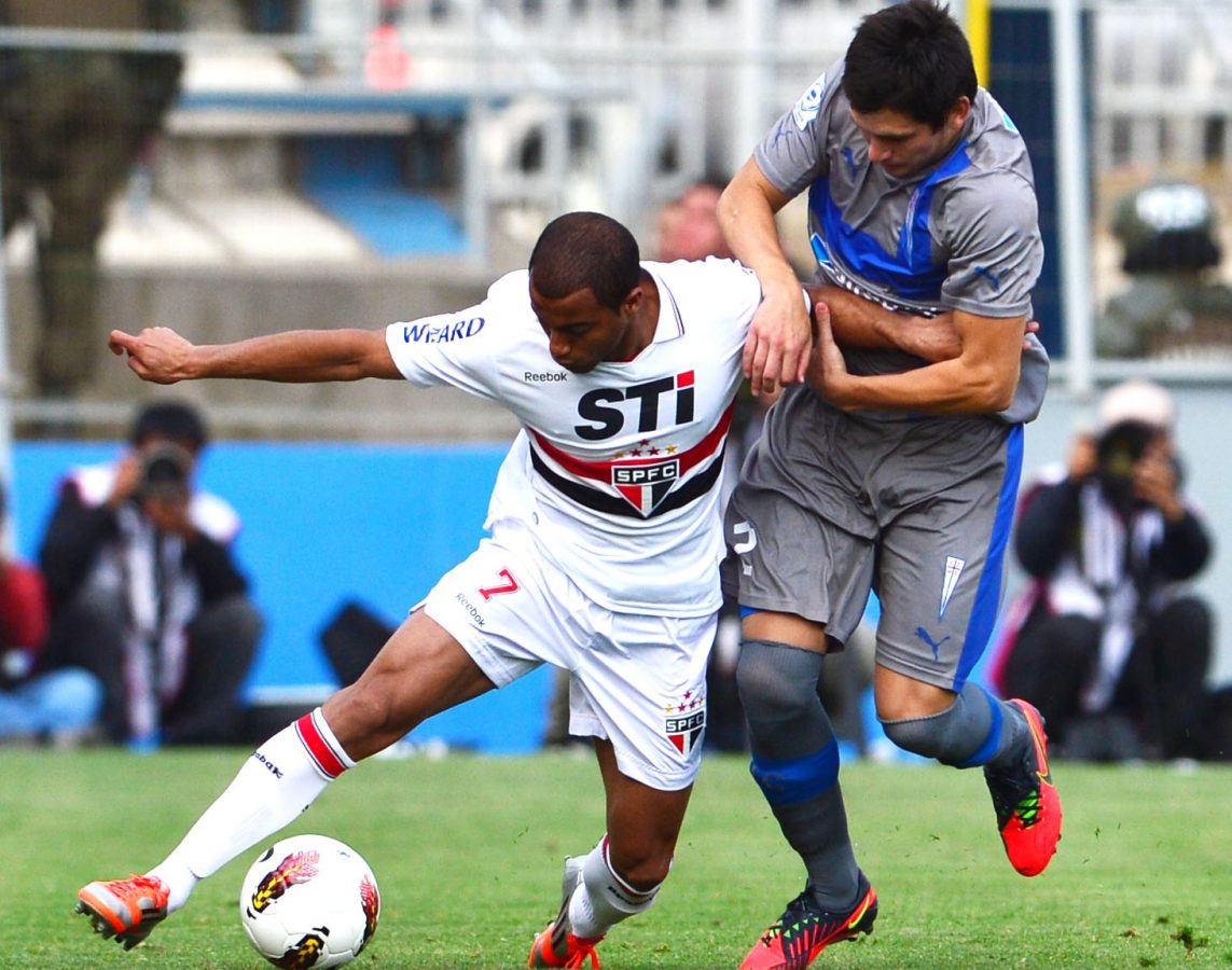 Chilean Universidad Catolica's Alfonso Parot vies for the ball with Sao Paulo's Lucas Moura during their 2012 Copa Sudamericana semi-final.